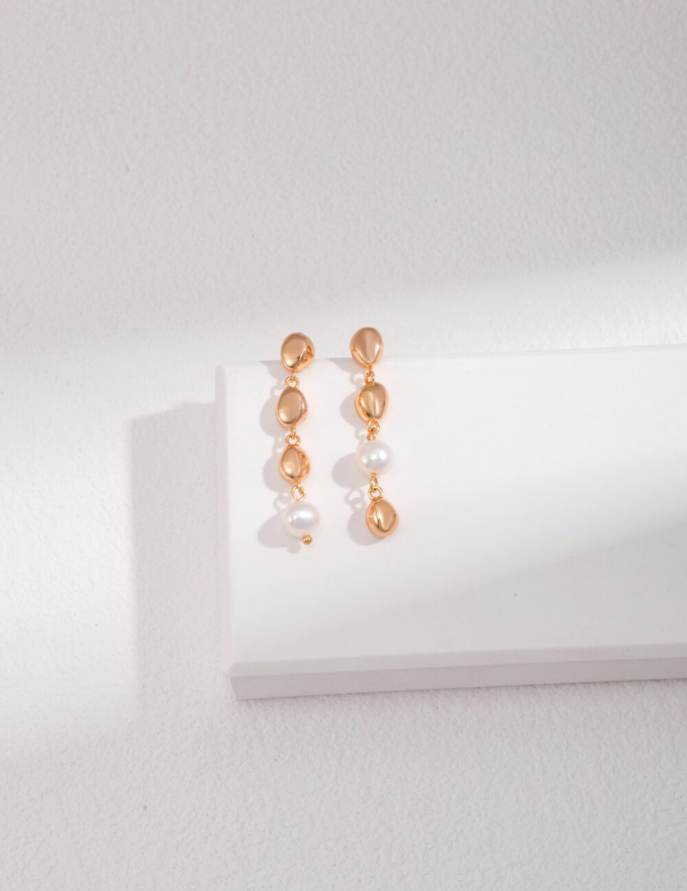 Cascade Asymmetry Pearl Drops